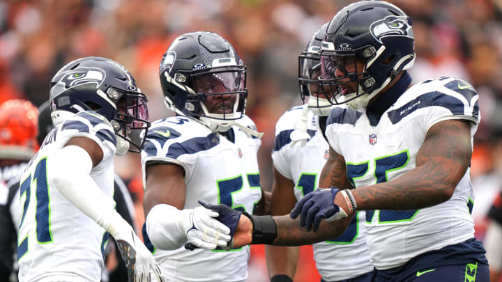 Seattle Seahawks defensive end Dre'Mont Jones (55) is congratulated by Seattle Seahawks linebacker Boye Mafe (53) and Seattle Seahawks cornerback Devon Witherspoon (21) after a sack in the third quarter during an NFL football game between the Seattle Seahawks and the Cincinnati Bengals Sunday, Oct. 15, 2023, at Paycor Stadium in Cincinnati.