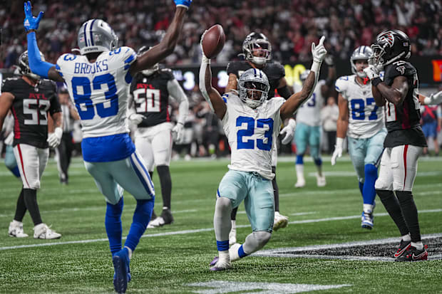 Dallas Cowboys running back Rico Dowdle reacts after making a juggling catch for a touchdown against the Atlanta Falcons.