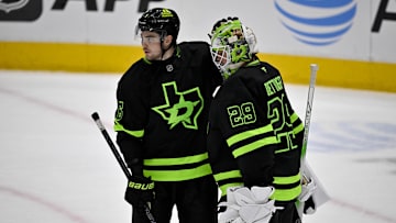 Apr 3, 2025; Dallas, Texas, USA; Dallas Stars defenseman Lian Bichsel (6) and goaltender Jake Oettinger (29) celebrate the win over the Nashville Predators at the American Airlines Center. Mandatory Credit: Jerome Miron-Imagn Images
