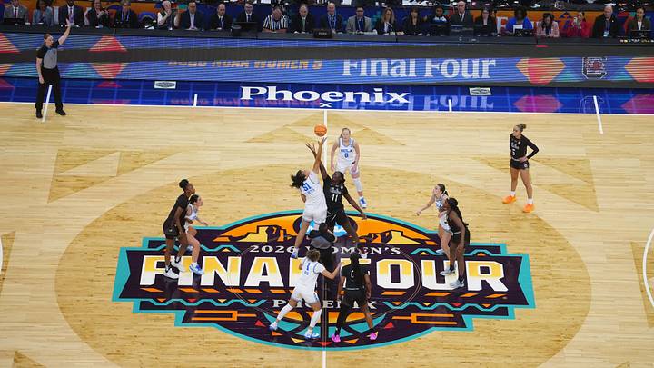 Apr 5, 2026; Phoenix, AZ, USA; A general overall view of the opening tipoff between UCLA Bruins center Lauren Betts (51) and South Carolina Gamecocks center Madina Okot (11) on the Final Four logo at midcourt during the National Championship game of the women's 2026 NCAA Tournament at Mortgage Matchup Center. Mandatory Credit: Kirby Lee-Imagn Images
