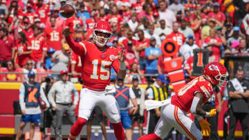 Aug 17, 2024; Kansas City, Missouri, USA; Kansas City Chiefs quarterback Patrick Mahomes (15) throws a pass after faking a handoff to running back Isiah Pacheco (10) against the Detroit Lions during the game at GEHA Field at Arrowhead Stadium. Mandatory Credit: Denny Medley-USA TODAY Sports