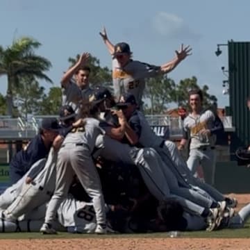 St. Thomas Aquinas celebrates after winning the Class 6A state baseball title with an 8-3 win against Buchholz.