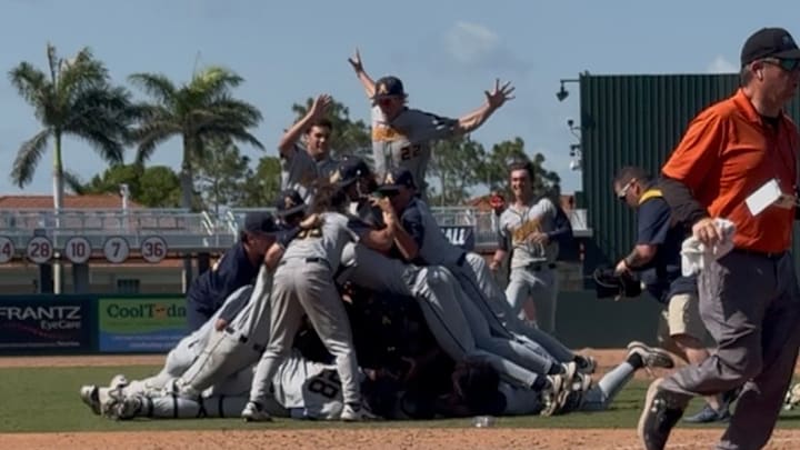 St. Thomas Aquinas celebrates after winning the Class 6A state baseball title with an 8-3 win against Buchholz.