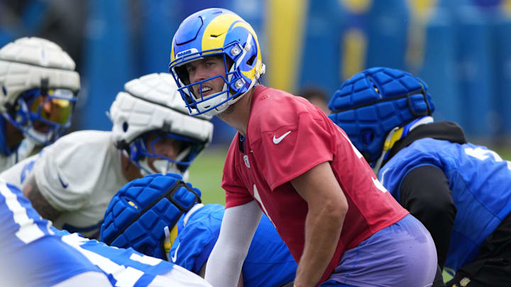 May 28, 2025; Woodland Hills, CA, USA; Los Angeles Rams quarterback Matt Stafford (9) readies to receive the snap during organized team activities at Rams Practice Facility. Mandatory Credit: Kirby Lee-Imagn Images