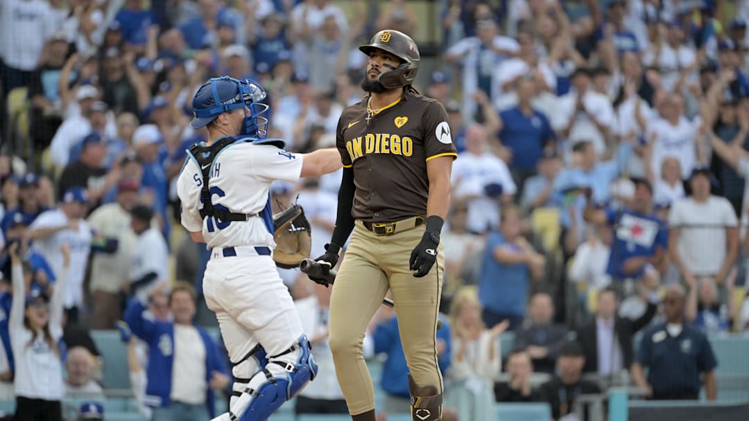 Oct 11, 2024; Los Angeles, California, USA; San Diego Padres outfielder Fernando Tatis Jr. (23) reacts after striking out in the first inning against the Los Angeles Dodgers during game five of the NLDS for the 2024 MLB Playoffs at Dodger Stadium. Mandatory Credit: Jayne Kamin-Oncea-Imagn Images