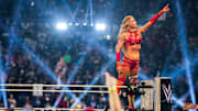 Charlotte Flair celebrates winning the WWE Royal Rumble at Lucas Oil Stadium in Indianapolis.