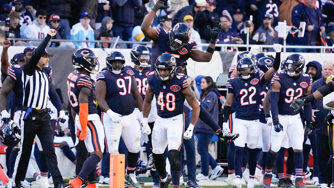 Nov 23, 2025; Chicago, Illinois, USA;  Chicago Bears linebacker Amen Ogbongbemiga (45) and linebacker D'Marco Jackson (48) react after a defensive stop during the second half at Soldier Field. Mandatory Credit: David Banks-Imagn Images