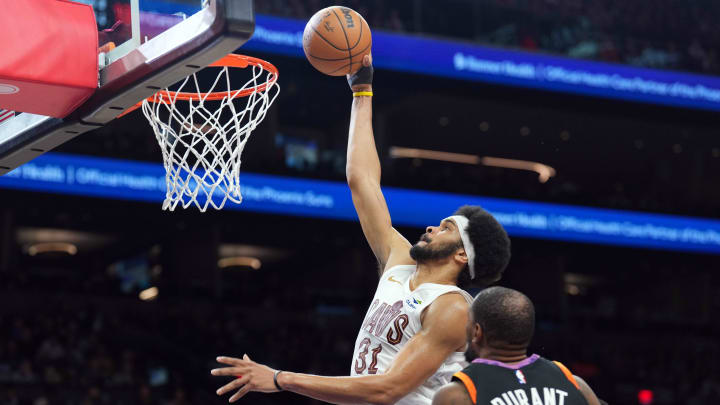 Apr 3, 2024; Phoenix, Arizona, USA; Cleveland Cavaliers center Jarrett Allen (31) dunks against Phoenix Suns forward Kevin Durant (35) during the second half at Footprint Center. Mandatory Credit: Joe Camporeale-USA TODAY Sports