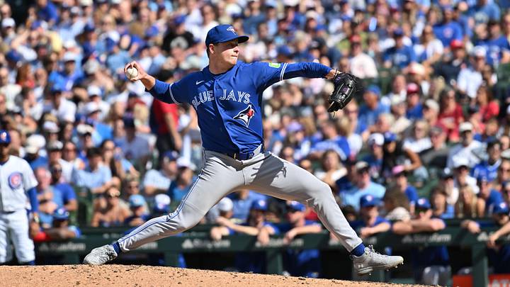 Jun 20, 2026; Chicago, Illinois, USA; Toronto Blue Jays pitcher Louis Varland (77) pitches against the Chicago Cubs during the ninth inning at Wrigley Field. Mandatory Credit: Patrick Gorski-Imagn Images