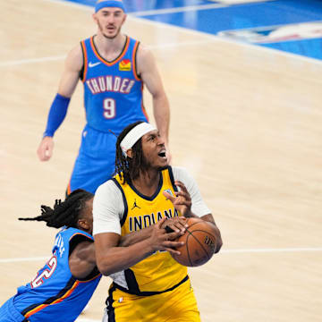 Jun 22, 2025; Oklahoma City, Oklahoma, USA; Indiana Pacers center Myles Turner (33) looks to shoot while Oklahoma City Thunder guard Cason Wallace (22) defends during the first half of game seven of the 2025 NBA Finals at Paycom Center. Mandatory Credit: Kyle Terada-Imagn Images