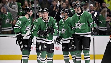 Jan 24, 2025; Dallas, Texas, USA; Dallas Stars left wing Jason Robertson (21) and right wing Evgenii Dadonov (63) and defenseman Matt Dumba (3) and defenseman Lian Bichsel (6) and center Wyatt Johnston (53) celebrates a goal scored by Robertson against the Vegas Golden Knights during the second period at the American Airlines Center. Mandatory Credit: Jerome Miron-Imagn Images
