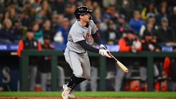 Apr 1, 2025; Seattle, Washington, USA; Detroit Tigers center fielder Ryan Kreidler (32) hits a single against the Seattle Mariners during the seventh inning at T-Mobile Park.