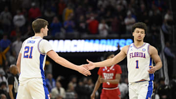 Mar 29, 2025; San Francisco, CA, USA; Florida Gators forward Alex Condon (21) and Florida Gators guard Walter Clayton Jr. (1) high-five during the second half against the Texas Tech Red Raiders during the West Regional final of the 2025 NCAA tournament at Chase Center. Mandatory Credit: Eakin Howard-Imagn Images