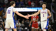 Mar 29, 2025; San Francisco, CA, USA; Florida Gators forward Alex Condon (21) and Florida Gators guard Walter Clayton Jr. (1) high-five during the second half against the Texas Tech Red Raiders during the West Regional final of the 2025 NCAA tournament at Chase Center. Mandatory Credit: Eakin Howard-Imagn Images