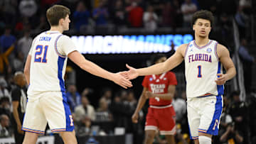 Mar 29, 2025; San Francisco, CA, USA; Florida Gators forward Alex Condon (21) and Florida Gators guard Walter Clayton Jr. (1) high-five during the second half against the Texas Tech Red Raiders during the West Regional final of the 2025 NCAA tournament at Chase Center. Mandatory Credit: Eakin Howard-Imagn Images