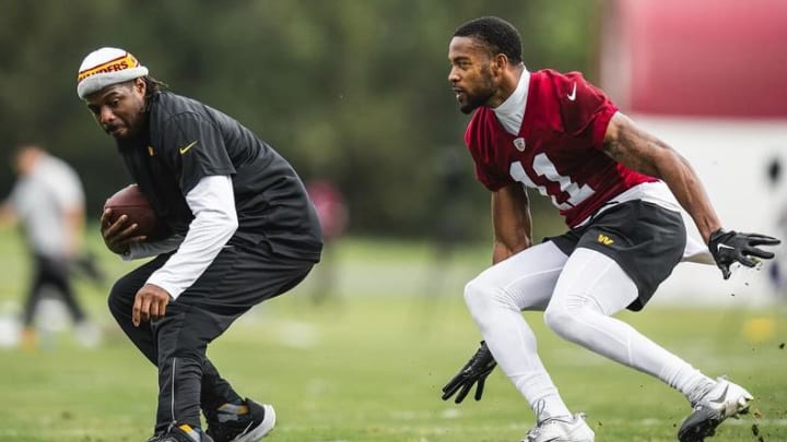 Washington Commanders assistant defensive backs coach William Gay (left) and safety Jeremy Chinn (right).