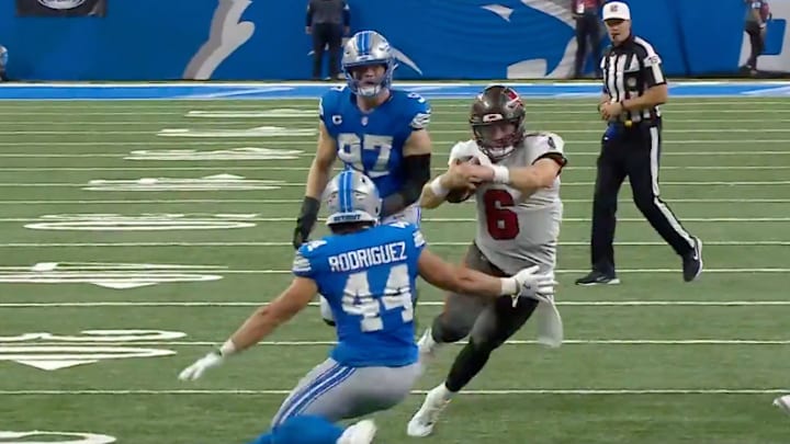 Mayfield runs with the ball and avoids a tackle from Rodriguez during Week 2 at Ford Field. 