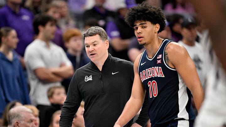 Jan 10, 2026; Fort Worth, Texas, USA; Arizona Wildcats head coach Tommy Lloyd talks with forward Koa Peat (10) during the second half against the TCU Horned Frogs at the Ed and Rae Schollmaier Arena. Mandatory Credit: Jerome Miron-Imagn Images