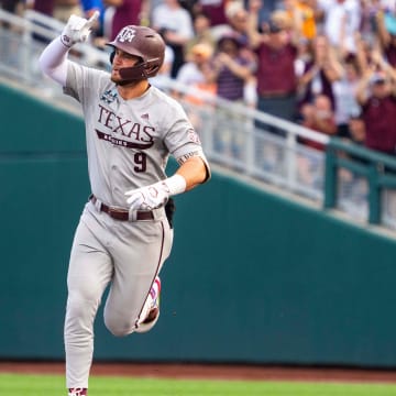 Jun 22, 2024; Omaha, NE, USA; Texas A&M Aggies third baseman Gavin Grahovac (9) celebrates after hitting a home run against the Tennessee Volunteers during the first inning at Charles Schwab Field Omaha. Mandatory Credit: Dylan Widger-USA TODAY Sports