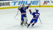 Aug 3, 2024; Plymouth, MI, USA; USA’s goaltender Hampton Slukynsky (30) raises his arms and celebrates the victory over Canada with teammate  forward Max Plante (14) during O.T. of the 2024 World Junior Summer Showcase at USA Hockey Arena. Mandatory Credit: David Reginek-Imagn Images