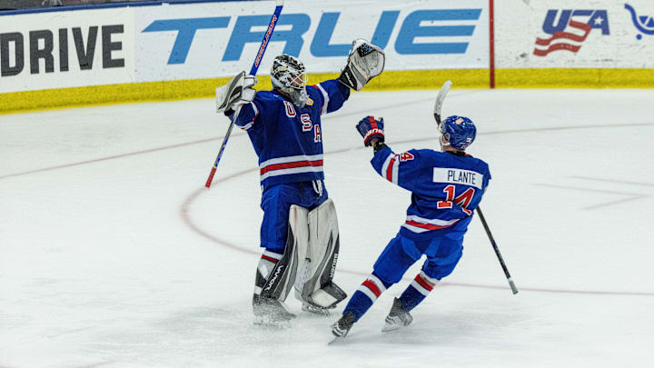 Aug 3, 2024; Plymouth, MI, USA; USA’s goaltender Hampton Slukynsky (30) raises his arms and celebrates the victory over Canada with teammate forward Max Plante (14) during O.T. of the 2024 World Junior Summer Showcase at USA Hockey Arena. Mandatory Credit: David Reginek-Imagn Images Aug 3, 2024; Plymouth, MI, USA; USA’s goaltender Hampton Slukynsky (30) raises his arms and celebrates the victory over Canada with teammate forward Max Plante (14) during O.T. of the 2024 World Junior Summer Showcase at USA Hockey Arena. Mandatory Credit: David Reginek-Imagn Images