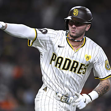 Sep 16, 2024; San Diego, California, USA; San Diego Padres center fielder Jackson Merrill (3) gestures toward the Padres dugout after hitting a home run against the Houston Astros during the fourth inning at Petco Park.