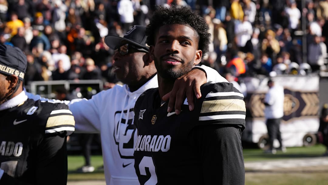 Nov 29, 2024; Boulder, Colorado, USA; Colorado Buffaloes quarterback Shedeur Sanders (2) and head coach Deion Sanders.