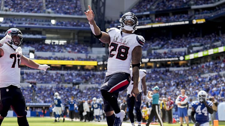 Sep 8, 2024; Indianapolis, Indiana, USA; Houston Texans running back Joe Mixon (28) celebrates after scoring a touchdown Sunday, Sept. 8, 2024, during a game against the Indianapolis Colts at Lucas Oil Stadium. Mandatory Credit: Grace Hollars/USA TODAY Network via Imagn Images