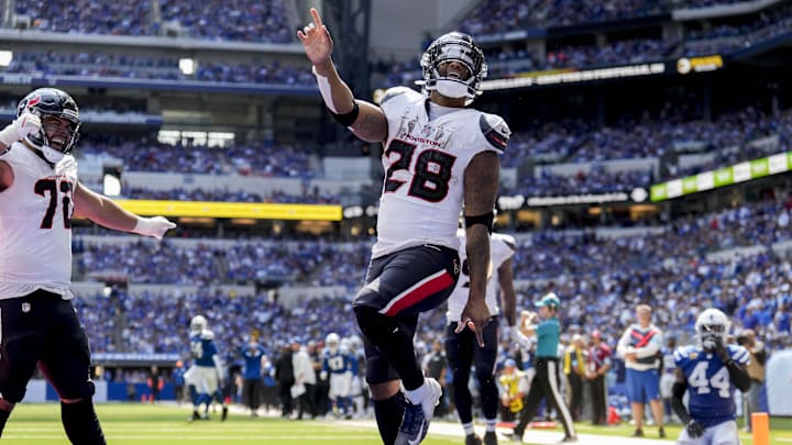 Sep 8, 2024; Indianapolis, Indiana, USA; Houston Texans running back Joe Mixon (28) celebrates after scoring a touchdown Sunday, Sept. 8, 2024, during a game against the Indianapolis Colts at Lucas Oil Stadium. Mandatory Credit: Grace Hollars/USA TODAY Network via Imagn Images