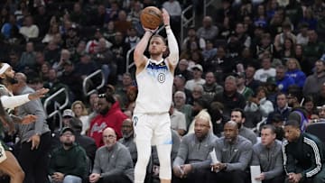Apr 8, 2025; Milwaukee, Wisconsin, USA; Minnesota Timberwolves guard Donte DiVincenzo (0) puts up a shot in the first half against the Milwaukee Bucks at Fiserv Forum. Mandatory Credit: Michael McLoone-Imagn Images