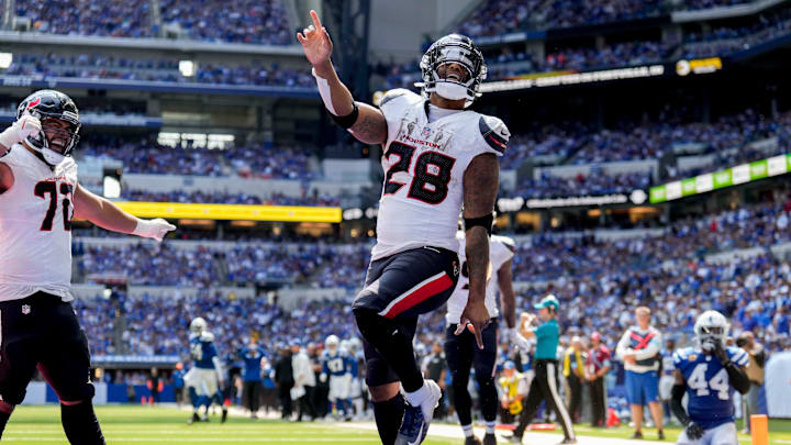 Houston Texans running back Joe Mixon (28) celebrates after scoring a touchdown Sunday, Sept. 8, 2024, during a game against the Indianapolis Colts at Lucas Oil Stadium in Indianapolis.