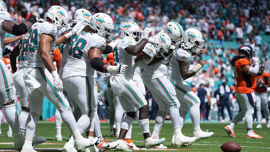 The Miami Dolphins offense does a dance routine after scoring against the Denver Broncos in the second quarter of an NFL game at Hard Rock Stadium in Miami Gardens, Sept. 24, 2023. The Miami Dolphins offense does a dance routine after scoring against the Denver Broncos in the second quarter of an NFL game at Hard Rock Stadium in Miami Gardens, Sept. 24, 2023.