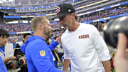 Sep 22, 2024; Inglewood, California, USA;  Los Angeles Rams head coach Sean McVay and San Francisco 49ers head coach Kyle Shanahan meet on the field following the game at SoFi Stadium. Mandatory Credit: Jayne Kamin-Oncea-Imagn Images