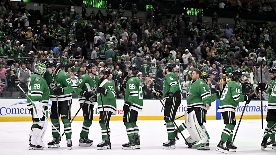 Mar 10, 2026; Dallas, Texas, USA; Dallas Stars goaltender Jake Oettinger (29) and the Stars celebrate on the ice after the victory over the Vegas Golden Knights at the American Airlines Center. Mandatory Credit: Jerome Miron-Imagn Images