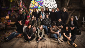 Wednesday. (L to R) Georgie Farmer, Victor Dorobantu, Luyanda Unati Lewis-Nayo, Joy Sunday, Owen Painter, Emma Myers, Billie Piper, Jenna Ortega, Evie Templeton, Luis Guzmán, Isaac Ordonez, Catherine Zeta-Jones, Alfred Gough, Noah Taylor, Miles Millar, Tim Burton, Steve Buscemi, Moosa Mostafa, Hunter Doohan on the set of Wednesday season 2. Cr. Helen Sloan/Netflix © 2024