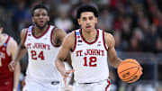 Mar 22, 2025; Providence, RI, USA; St. John's Red Storm guard RJ Luis Jr. (12) dribbles during the second half of a second round men’s NCAA Tournament game against the Arkansas Razorbacks at Amica Mutual Pavilion. Mandatory Credit: Brian Fluharty-Imagn Images