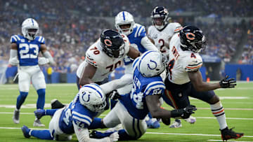 Indianapolis Colts defensive end Tyquan Lewis (94) works to bring down Chicago Bears running back D'Andre Swift (4) on Sunday, Sept. 22, 2024, during a game against the Chicago Bears at Lucas Oil Stadium in Indianapolis.