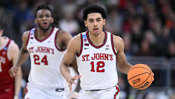 Mar 22, 2025; Providence, RI, USA; St. John's basketball guard RJ Luis Jr. (12) dribbles during the second half of a second round men’s NCAA Tournament game against the Arkansas Razorbacks at Amica Mutual Pavilion.