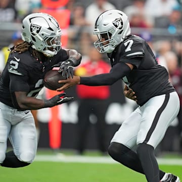 Nov 2, 2025; Paradise, Nevada, USA; Las Vegas Raiders quarterback Geno Smith (7) hands off the ball to Las Vegas Raiders running back Ashton Jeanty (2) during the first quarter against the Jacksonville Jaguars at Allegiant Stadium. Mandatory Credit: Kirby Lee-Imagn Images