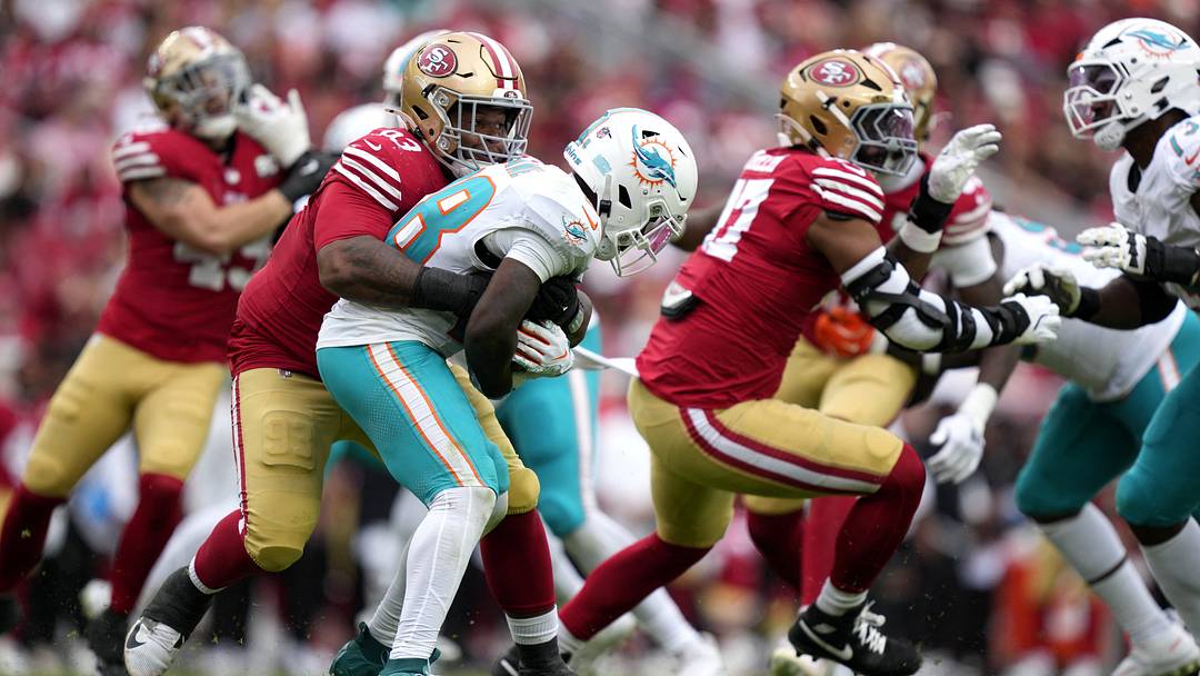 San Francisco 49ers defensive tackle Gracen Halton (93) tackles Miami Dolphins running back De'Von Achane (28) in the fourth quarter at Levi's Stadium. San Francisco 49ers defensive tackle Gracen Halton (93) tackles Miami Dolphins running back De'Von Achane (28) in the fourth quarter at Levi's Stadium.