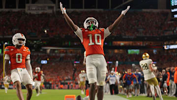 Aug 31, 2025; Miami Gardens, Florida, USA; Miami Hurricanes wide receiver Malachi Toney (10) reacts after scoring a touchdown against the Notre Dame Fighting Irish during the first quarter at Hard Rock Stadium. Mandatory Credit: Sam Navarro-Imagn Images
