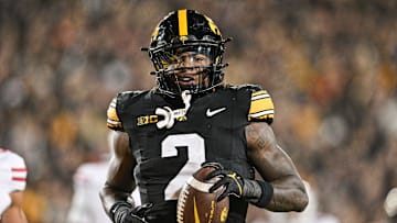 Nov 2, 2024; Iowa City, Iowa, USA;  Iowa Hawkeyes running back Kaleb Johnson (2) runs for a 16 yard touchdown against the Wisconsin Badgers during the second quarter at Kinnick Stadium.