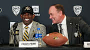 Dec 4, 2022; Boulder, CO, USA; Colorado Buffaloes head coach Deion Sanders and athletic director Rick George during a press conference at the Arrow Touchdown Club. Mandatory Credit: Ron Chenoy-Imagn Images