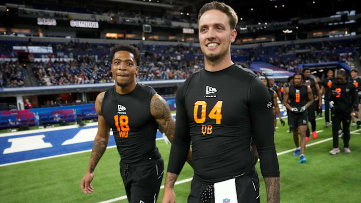 Feb 28, 2026; Indianapolis, IN, USA; Miami wideout CJ Daniels (WO18) walks with Miami quarterback Carson Beck (QB04) during the NFL Scouting Combine at Lucas Oil Stadium. Mandatory Credit: Kirby Lee-Imagn Images