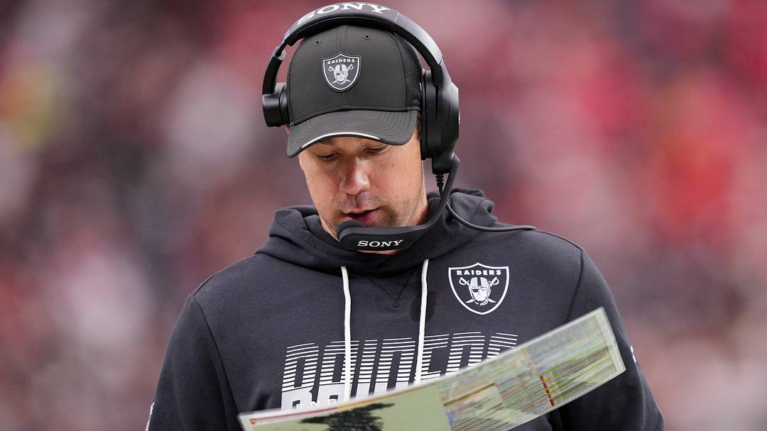 Oct 4, 2026; Paradise, Nevada, USA;  Las Vegas Raiders head coach Klint Kubiak looks at his play sheet against the Kansas City Chiefs during the third quarter at Allegiant Stadium.  Mandatory Credit: Joe Camporeale-Imagn Images
