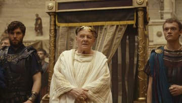 THOSE ABOUT TO DIE -- Episode 101 --Pictured: (l-r) Tom Hughes as Titus, Anthony Hopkins as Emperor Vespasian, Jojo Macari as Domitian (Photo by: PEACOCK)