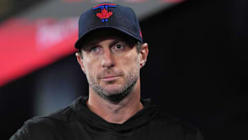 Mar 28, 2025: Toronto Blue Jays starting pitcher Max Scherzer (31) walks in the dugout before the start of a game against the Baltimore Orioles at Rogers Centre.