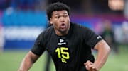 Feb 27, 2025; Indianapolis, IN, USA; Oregon defensive lineman Derrick Harmon (DL15) participates in drills during the 2025 NFL Combine at Lucas Oil Stadium. Mandatory Credit: Kirby Lee-Imagn Images