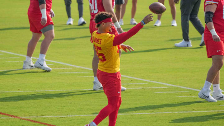 Jul 22, 2024; St. Joseph, MO, USA; Kansas City Chiefs quarterback Patrick Mahomes (15) throws a pass running drills during training camp at Missouri Western State University. Mandatory Credit: Denny Medley-USA TODAY Sports