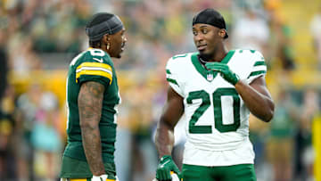 Aug 9, 2025; Green Bay, Wisconsin, USA; Green Bay Packers wide receiver Mecole Hardman (6) talks with New York Jets running back Breece Hall (20) during warmups before a preseason game at Lambeau Field. Mandatory Credit: Kayla Wolf-Imagn Images